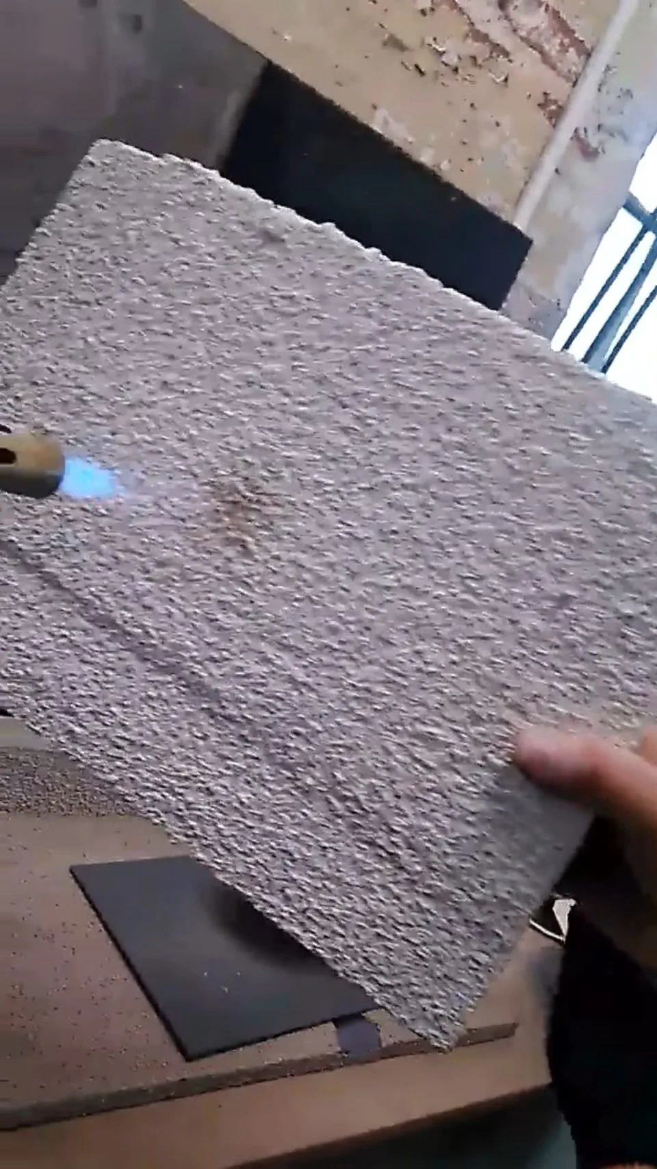 Heat test — 2mm cork wall render over polystyrene insulation board, straight under the heat gun. It just doesn't burn. The possibilities are endless.